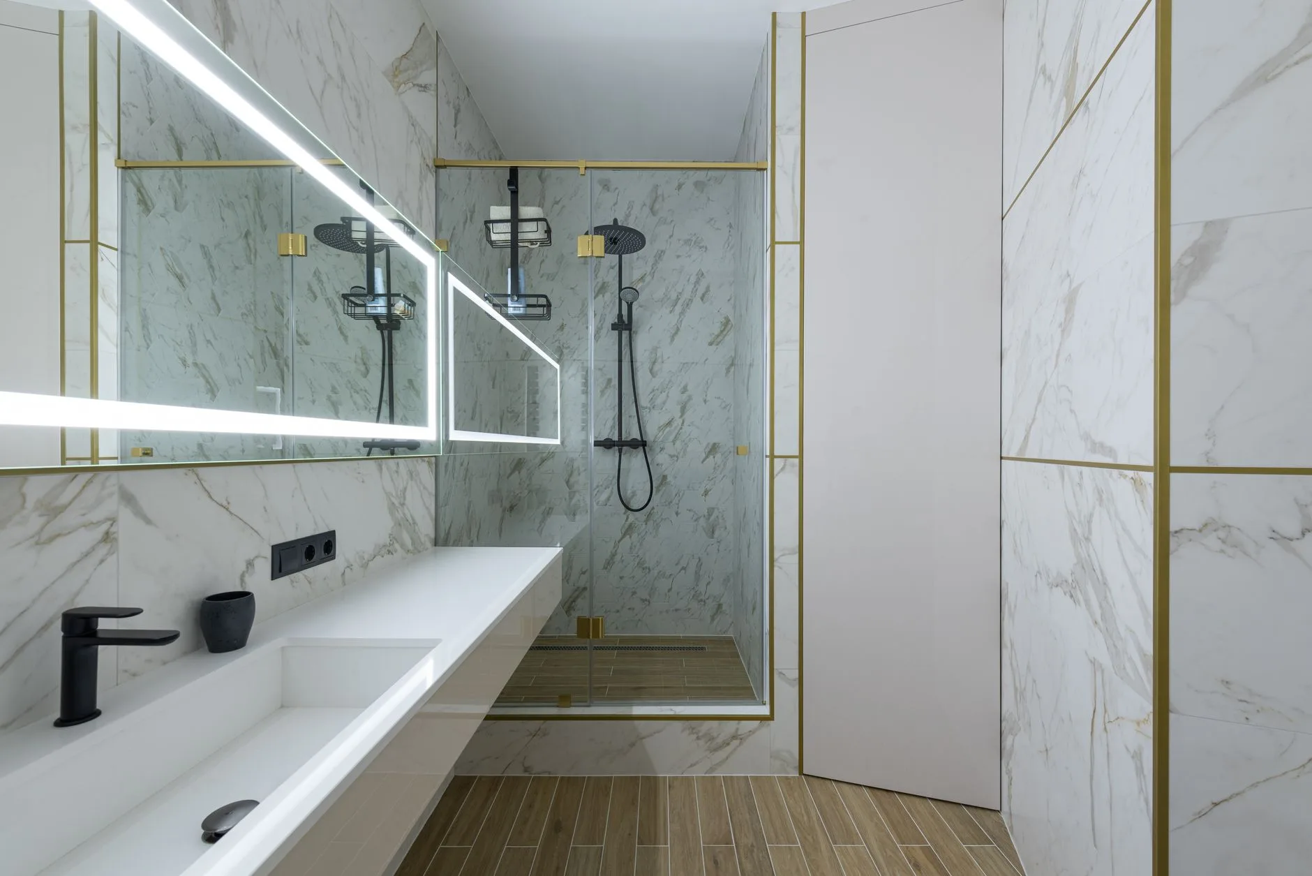 Bright modern bathroom with marble tile shower and large window